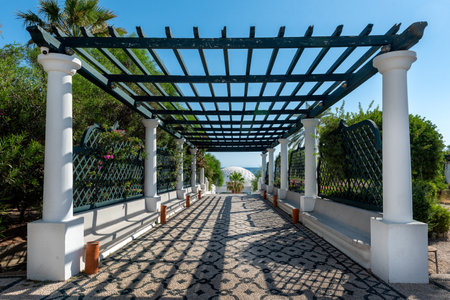 Way with pergola to Dome in Kalithea (Rhodes, Greece) - Text translation: "Reps sneaking through the rocks"の写真素材