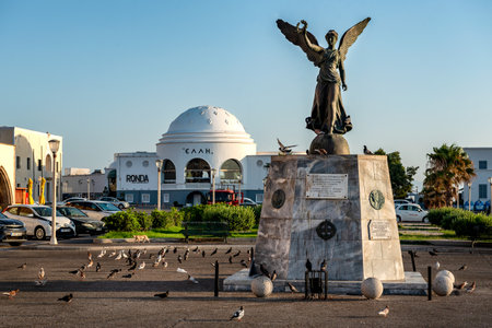 Rhodes, Greece. July 3, 2024: Angel statue of victory in Mandraki harbor in Rodos Town.のeditorial素材