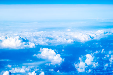An abstract image of the sky with clouds taken from an airplane from a high angle.の写真素材