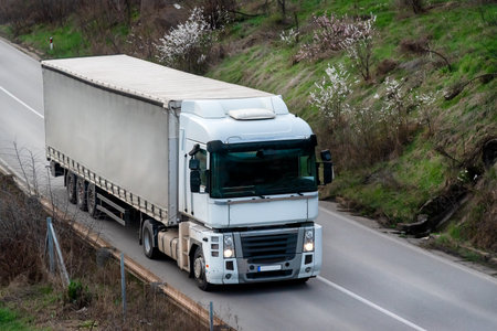 White transportation truck on a countryside highway close upの写真素材