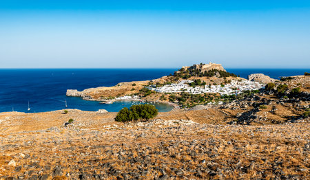 Panorama of Lindos bay with Lindos beach and ancient Greek town Lindos, Rhodes island, Greeceの写真素材