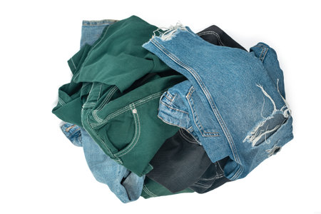 Blue and color jeans isolated on white background, jeans stacked, clipping path includedの写真素材