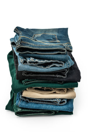 Blue and color jeans isolated on white background, jeans stacked, recycle, clipping path included