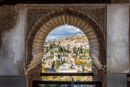Alhambra Arch Granada Cityscape in Andalusia Spain. Alhambra Castle Arch Intricade Moorish Designs Cityscape Granada Andalusia Spainの写真素材