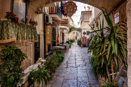 Bari, Italy - March 7, 2025: Typical narrow street in Bari old town, Puglia, Italy, in a beautiful spring dayのeditorial素材