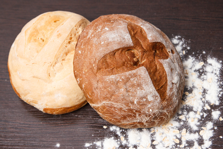Fresh bread on a wooden tableの写真素材