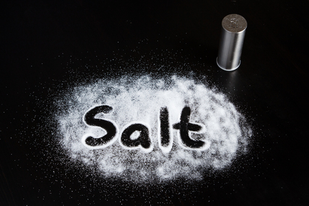of scattered salt on the salt inscriptionの写真素材