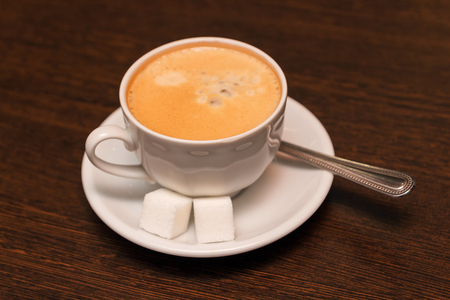 A cup of coffee with sugarの写真素材