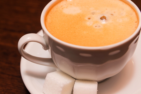 A cup of coffee with sugarの写真素材