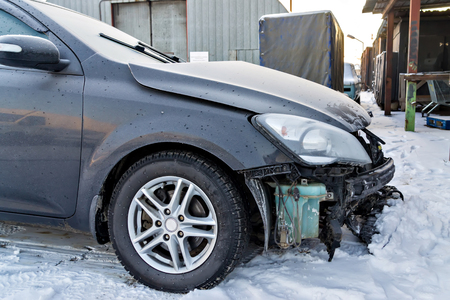 Black car after a winter accidentの写真素材