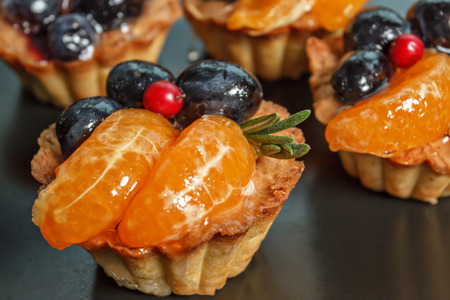 sand basket with fresh berries and fruitsの写真素材
