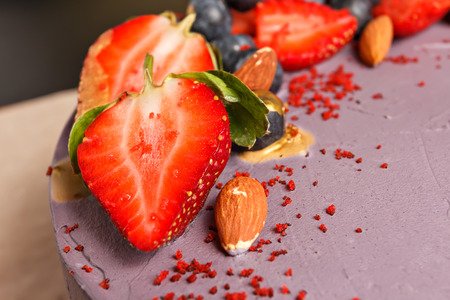 cake with fresh berries in a cutの写真素材