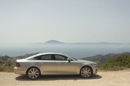 Spain, Campamento June 16 2016 Volvo S90 on seacoast with montains during TEST DRIVEのeditorial素材