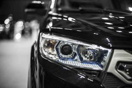headlight of black modern car with led and xenon opticsの写真素材