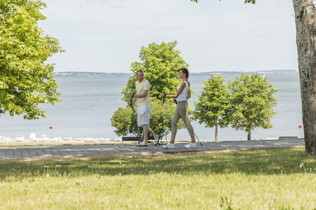 Young couple hiking in the nature nordic walkingの写真素材