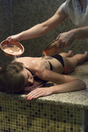 Young woman massage in hammam or turkish bath.の写真素材