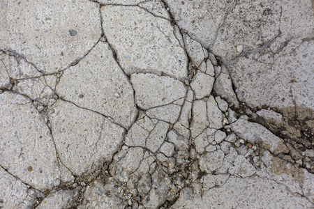cracks in the stone floor pattern texture backgroundの写真素材