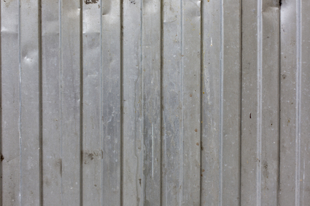 metal surface vertical stripes pattern texture backgroundの写真素材