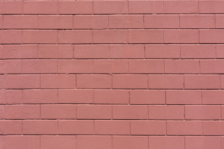 red painted horizontal stone bricks wall pattern texture backgroundの写真素材