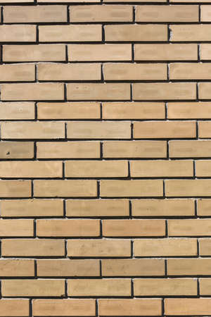 yellow stone bricks wall pattern texture backgroundの写真素材