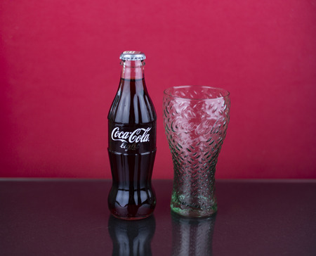 Atlanta, Georgia, USA - July 22, 2018: green glass and glass contour coca-cola light classic bottle...