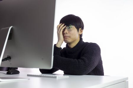 Exhausted asian men feeling headache from deadlines. Depressed, burnout concept