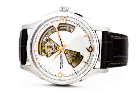 Biel, Switzerland 31.03.2020 - The close up of Hamilton man watch stainless steel case white clock...