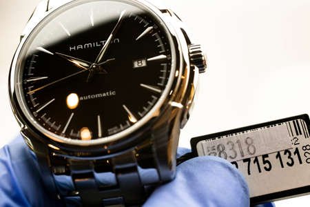 Biel, Switzerland 31.03.2020 - The close up of Hamilton man watch stainless steel case black clock...