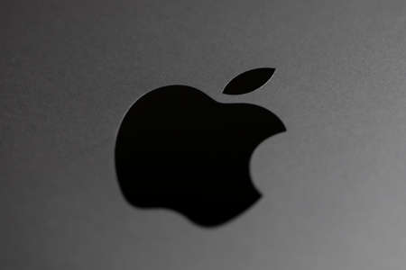 Cupertino, CA, US, 22.04.2020: black Apple logo on silver 16-inch MacBook Proのeditorial素材