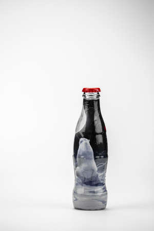 Atlanta, Georgia, USA April 1, 2020: classic contour glass bottle of Coca Cola from USA Limited Edition Coke brand. Polar bears ads print closeup isolated on white backgroundのeditorial素材