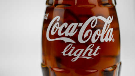 Atlanta, Georgia, USA April 1, 2020: classic contour glass bottle of Coca Cola Light from USA label closeup. Coca-Cola logoのeditorial素材