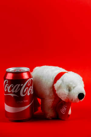 Atlanta, Georgia, USA April 1, 2020: souvenir polar bear Coca-Cola isolated on red background and...
