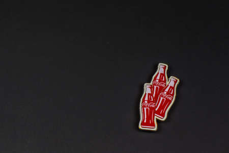 Atlanta, Georgia, USA April 1, 2020: closeup of magnet in the shape of three classic Coca-Cola...