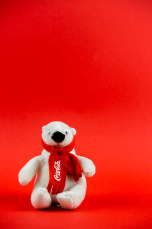 Atlanta, Georgia, USA April 1, 2020: souvenir polar bear Coca-Cola sitting isolated on red...