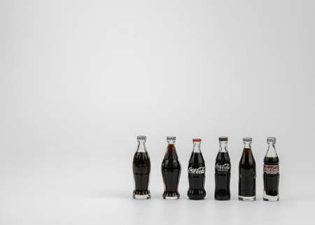 Atlanta GA USA May 1 2020 six toy glass Coca-Cola contour bottles rare shapesのeditorial素材