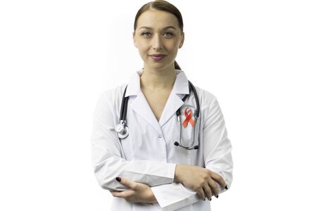 30s Female doctor with red ribbon for AIDS HIV awareness on white backgroundの写真素材