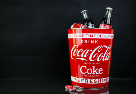 Atlanta, GA, USA April 1, 2020 red bucket with bottles and cans of Coca Cola