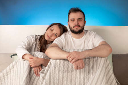 Portrait of young happy couple. cheerful bearded man and pretty smiling Brunette girl relaxing in...