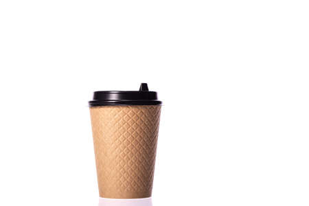 one take away disposable paper coffee cup with black biodegradable cap isolated on white background. Plastic pollution reduction concept. Zero waste concept. Minimalism style. copy spaceの写真素材