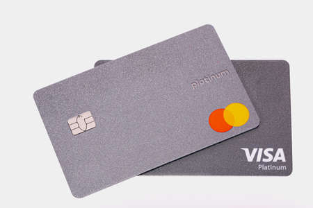 St. Louis, MO, USA - Sep 1, 2020: platinum cards Visa and MasterCard isolated on white backdrop....