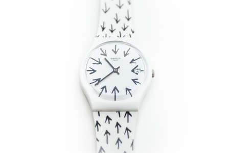 Rome, Italy 07.10.2020 - Swatch childrens trendy swiss made quartz watch isolated on white background. white plastic case, youth hipster style watch for bright image. Swatch Group watch productionのeditorial素材