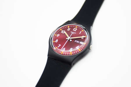 New York, NY, USA 07.10.2020 - Swatch swiss made quartz watch isolated on white background. ruby...