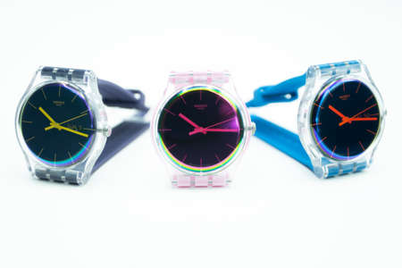 Paris, France 07.10.2020 - three Swatch swiss made quartz watch isolated on white background....