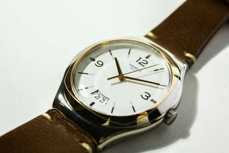 Paris, France 07.10.2020 - Swatch classic design swiss made quartz watch isolated on white background. metal case, Swatch Group watch production. 10.10 pmのeditorial素材