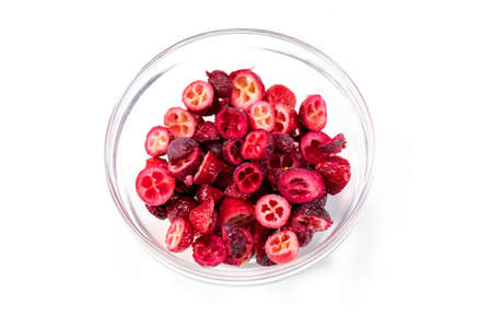 Freeze-dried organic lingonberry cowberry forest berries cutaway in glass bowl for cakes, handmade chocolates. Filling for porridge, muesli, yogurt, sauce, dressing. Pastry, natural food conceptの写真素材