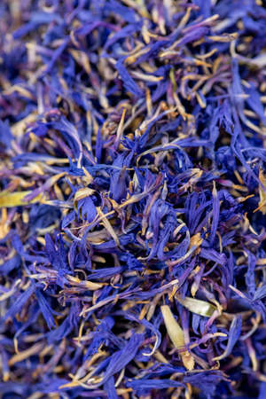 Natural spring floral background. Bright blue dried flowers texture, cornflower petals. Organic healthy herbal tea concept, exotic eco products, fragrant cosmetics, aromatherapy, homeopathic medicineの写真素材