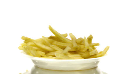 Golden french fries on plastic disposable plate rotating on isolated white background. Fast food...