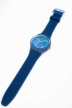 Rome, Italy 07.10.2020 - Swatch childrens trendy swiss made quartz watch isolated on white. blue Plastic case and silicone strap. Green seconds arrow. Green Technology Timeのeditorial素材
