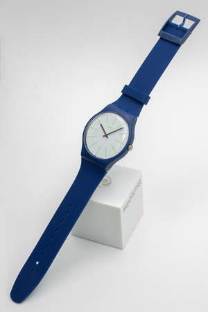 Rome, Italy 07.10.2020 - Swatch childrens trendy swiss made quartz watch isolated on white. blue Plastic case and silicone strap. Green marks on dial. Green Technology Timeのeditorial素材