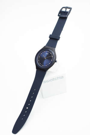 Rome, Italy 07.10.2020 - Swatch fashion swiss made quartz watch isolated on brand stand. blue plastic case and silicone strap. Swatch Group watch productionのeditorial素材